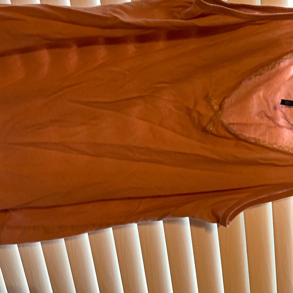 A pink shirt with design